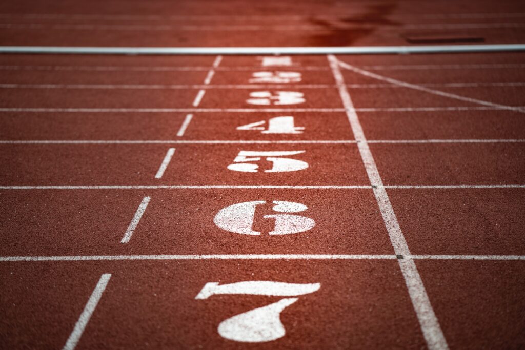Starting block spaces and lanes on a track, with spaces numbered 1 through 7.